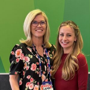 Caralee Hammer Frederic stands with retired U.S. pair skater Tarah Kayne, a 2016 U.S. pairs champion, 2018 Four Continents champion, and current U.S. Figure Skating Pairs Development Coordinator.